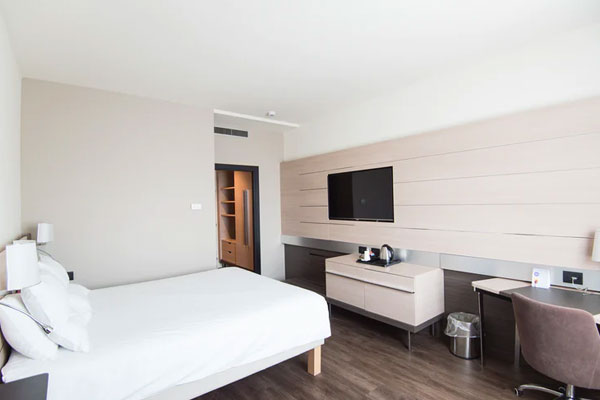 Comfortable hotel room with bed